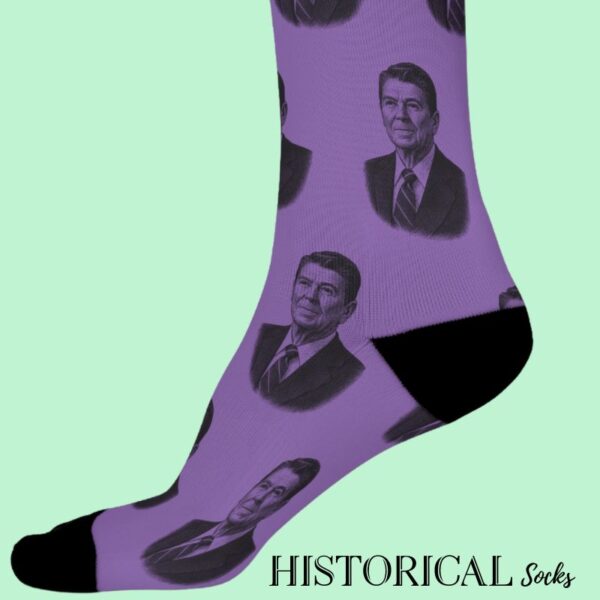 Close-up of Ronald Reagan-themed socks in purple with vintage-style illustration