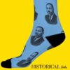 Side view of Martin Luther King Jr. socks in blue with black accents, worn on standing legs