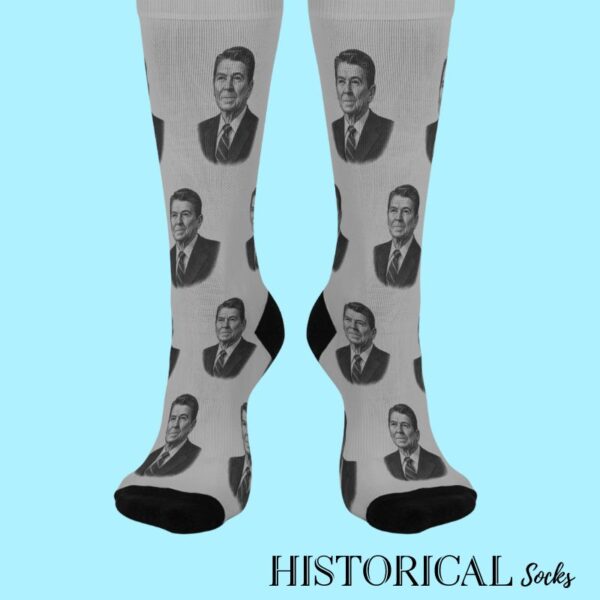 Gray socks featuring Ronald Reagan's portrait, worn on standing feet