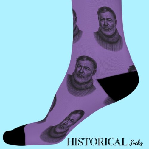 ide view of purple socks featuring Ernest Hemingway illustration, worn on feet