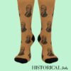 Front-facing view of legs wearing brown Alexander Hamilton socks with black heels and toes