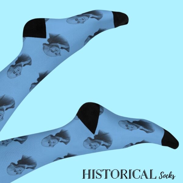 George Washington portrait socks in blue, worn with legs raised