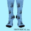 George Washington socks in blue with repeated portrait, full front view worn on legs