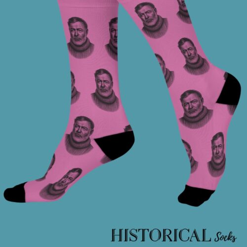 Side profile of Ernest Hemingway socks pink on feet, with black toe and heel contrast