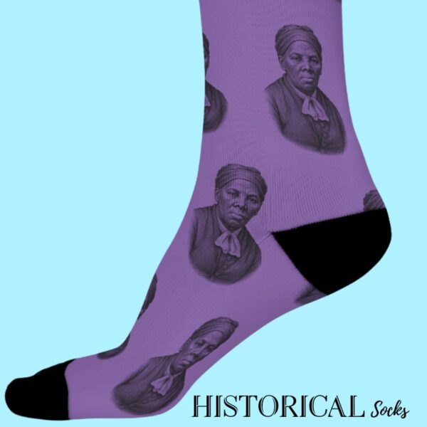 Side view of Harriet Tubman Socks in purple, showing her portrait pattern and comfortable slim fit during a walking pose.