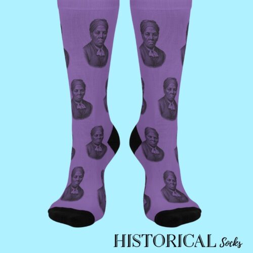 Front view of Harriet Tubman Socks in purple featuring detailed historical portrait design and bold black heels and toes.