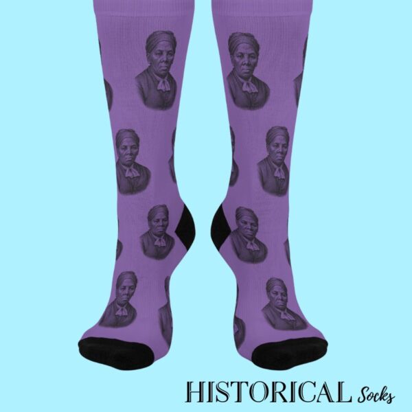 Front view of Harriet Tubman Socks in purple featuring detailed historical portrait design and bold black heels and toes.