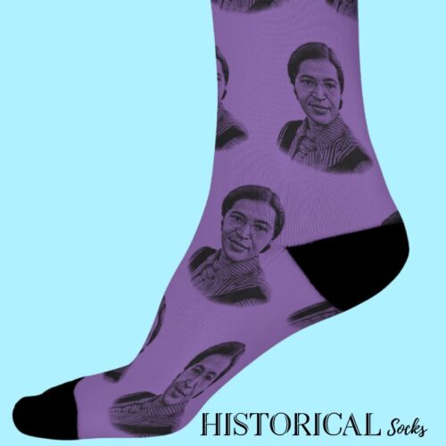 Side view of Rosa Parks Socks in purple with black heel and toe, worn mid-step to showcase portrait design.