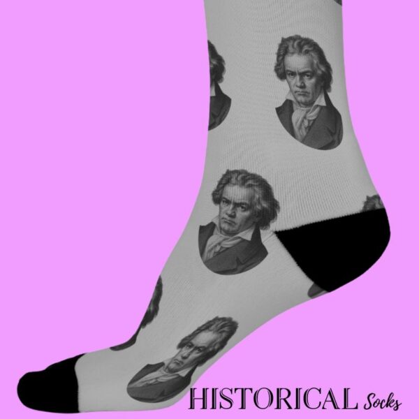 Side view of Ludwig van Beethoven socks in gray with repeated illustrated portrait design and black detailing