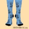 Front view of blue Sigmund Freud socks with repeated portrait pattern and black heel and toe