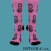 Front view of Ernest Hemingway pink socks with repeated portrait pattern and black toe