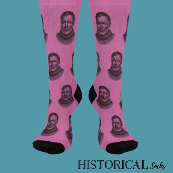 Front view of Ernest Hemingway pink socks with repeated portrait pattern and black toe
